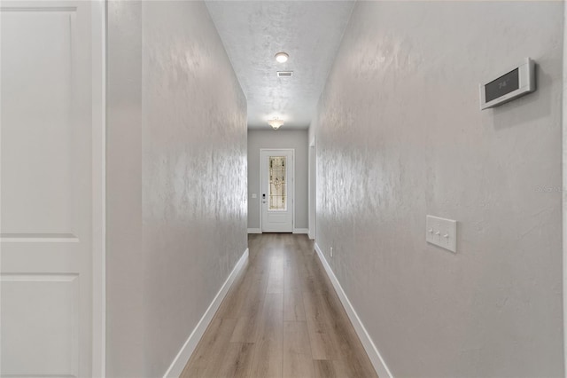 1029 NW 132nd Blvd, Newberry, FL 32669 - corridor featuring wood finished floors and baseboards