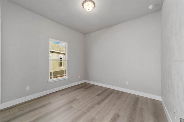 unfurnished room with light hardwood / wood-style flooring