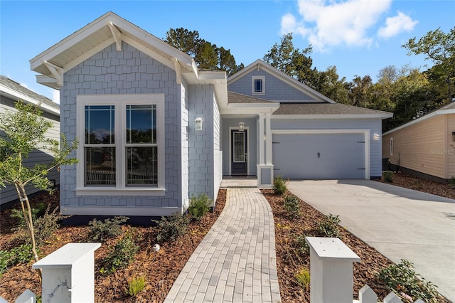 1029 NW 132nd Blvd, Newberry, FL 32669 - view of front of property with a garage, driveway, and roof with shingles