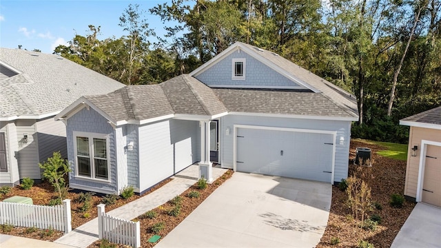 1029 NW 132nd Blvd, Newberry, FL 32669 - view of front of property with fence, roof with shingles, driveway, and an attached garage