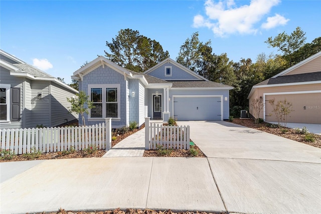 1029 NW 132nd Blvd, Newberry, FL 32669 - view of front of home featuring driveway, a garage, and cooling unit
