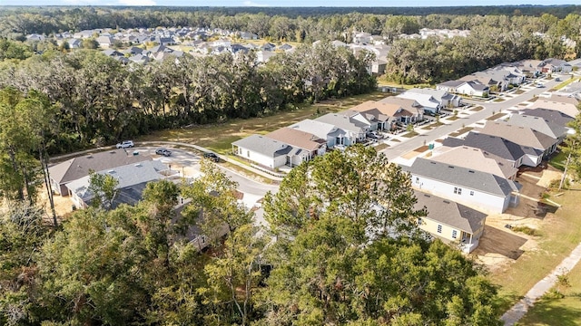 1029 NW 132nd Blvd, Newberry, FL 32669 - aerial overview of property's location with nearby suburban area and a heavily wooded area