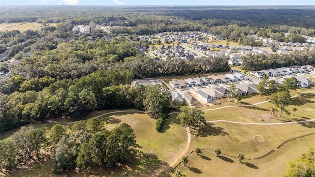 1029 NW 132nd Blvd, Newberry, FL 32669 - aerial overview of property's location with nearby suburban area and a heavily wooded area
