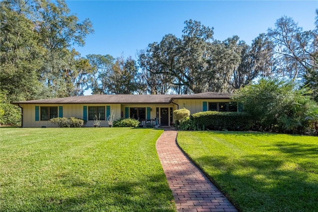 ranch-style home featuring a front yard