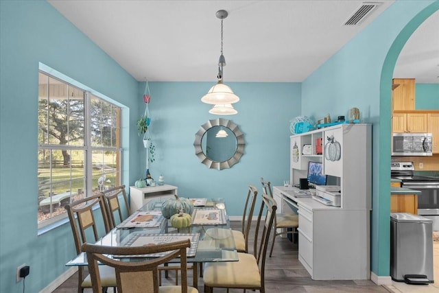 dining space featuring light wood-type flooring