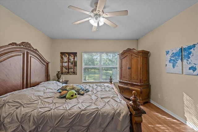 bedroom with light hardwood / wood-style flooring and ceiling fan