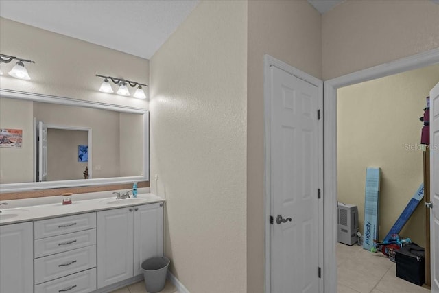 bathroom with tile patterned flooring and vanity