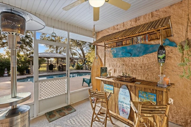 sunroom / solarium with ceiling fan