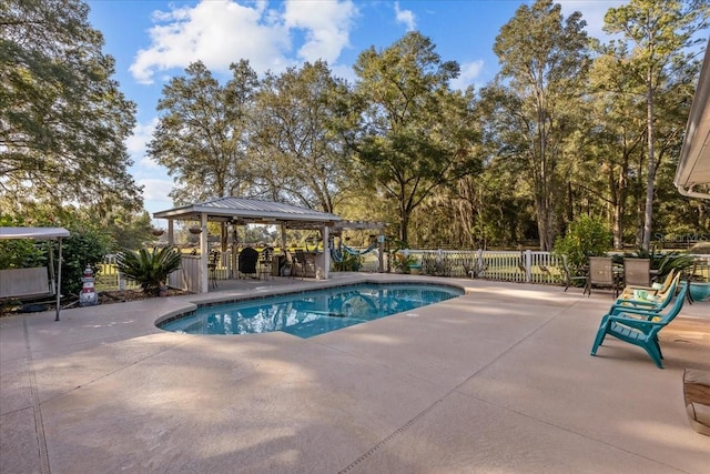 view of swimming pool featuring a gazebo and a patio area