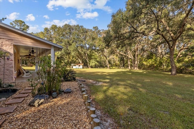 view of yard featuring ceiling fan