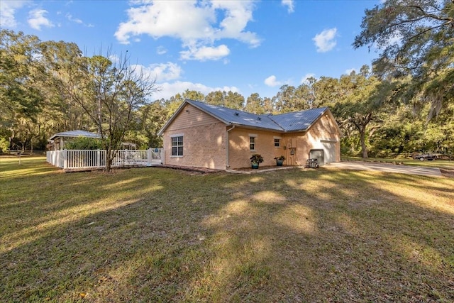 view of home's exterior with a yard