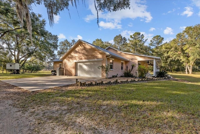 single story home featuring a front yard and a garage