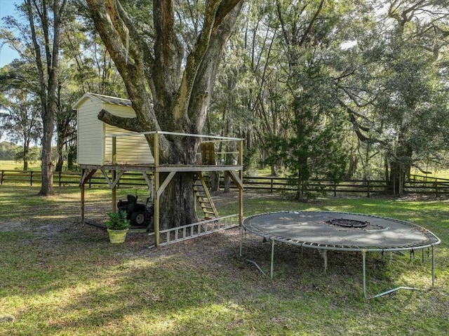 view of yard with a trampoline