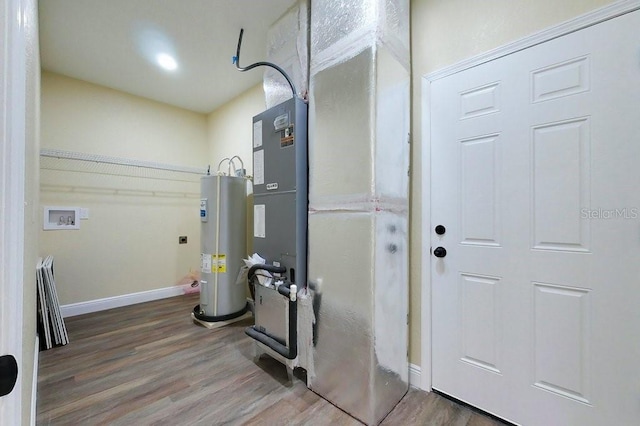 utility room featuring water heater