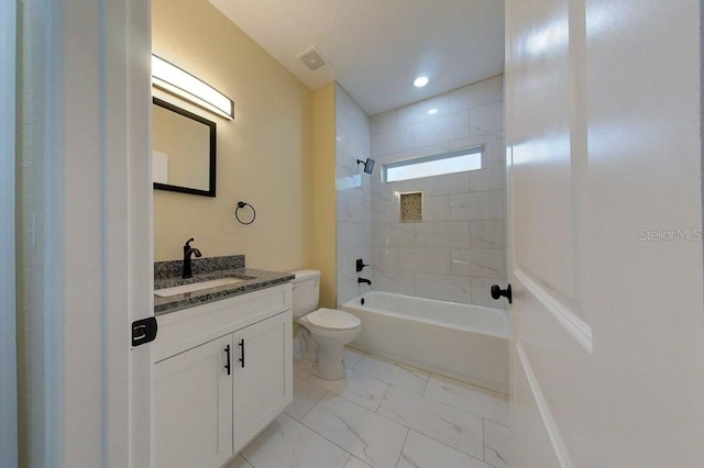 full bathroom featuring vanity, toilet, and tiled shower / bath combo