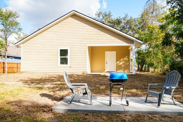 back of house with a patio