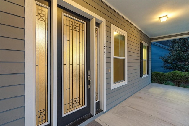 doorway to property with covered porch