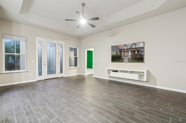 unfurnished living room with hardwood / wood-style floors and ceiling fan