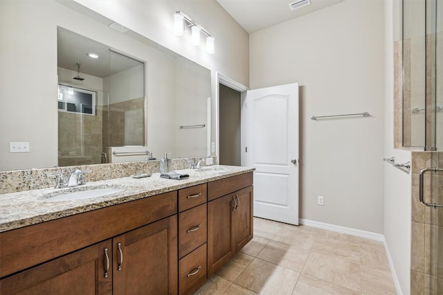 bathroom with vanity, tile patterned flooring, and a shower with door