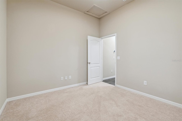 empty room with light colored carpet