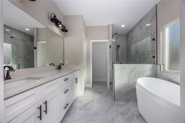 bathroom with vanity and independent shower and bath