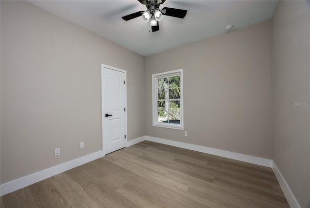 spare room featuring ceiling fan and light wood-type flooring