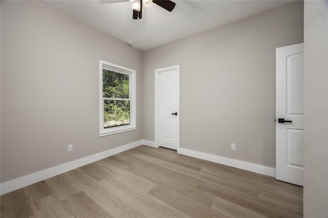 spare room with ceiling fan and light hardwood / wood-style floors