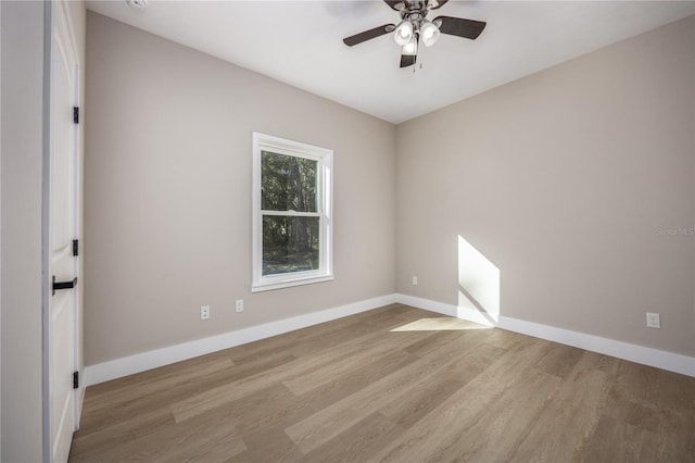 unfurnished room with ceiling fan and light hardwood / wood-style flooring