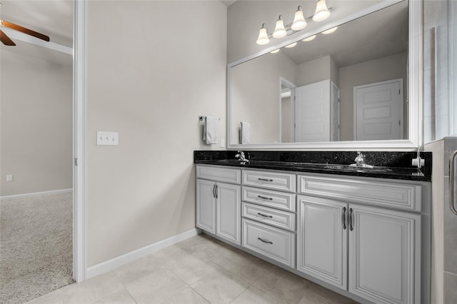 bathroom featuring ceiling fan, tile patterned flooring, and vanity