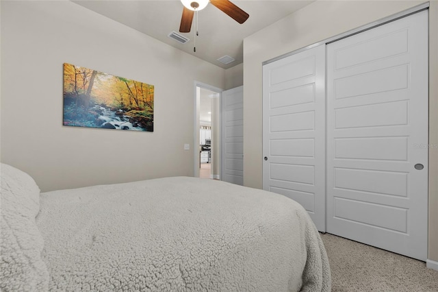 bedroom with ceiling fan and a closet