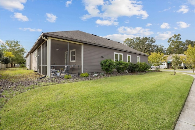 1237 NW 137th Way, Newberry, FL 32669 - view of property exterior featuring a yard, a sunroom, and a shingled roof