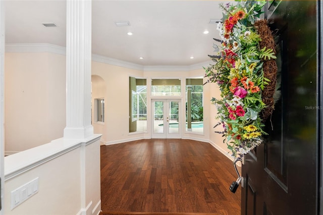 entryway with dark hardwood / wood-style floors, ornamental molding, french doors, and decorative columns