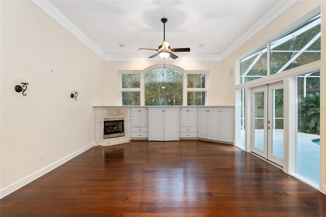 bar with crown molding, a fireplace, white cabinetry, dark hardwood / wood-style floors, and ceiling fan