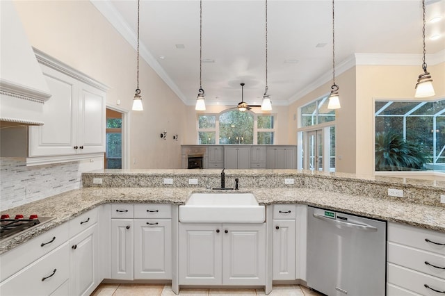 kitchen with ornamental molding, white cabinetry, pendant lighting, sink, and stainless steel dishwasher