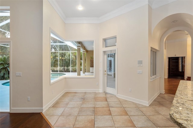 tiled entryway with ornamental molding