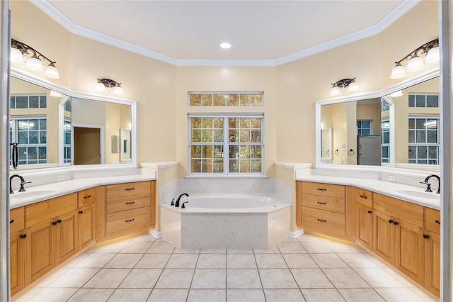 bathroom with ornamental molding, tile patterned flooring, vanity, and a tub to relax in