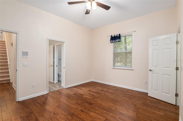 unfurnished bedroom featuring connected bathroom, ceiling fan, and dark hardwood / wood-style floors