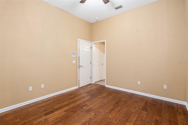 spare room featuring wood-type flooring and ceiling fan