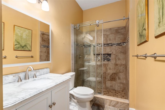 bathroom with an enclosed shower, vanity, tile patterned floors, and toilet