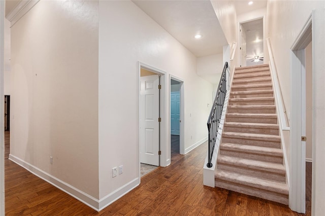 stairway featuring hardwood / wood-style flooring