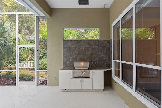 unfurnished sunroom featuring a wealth of natural light