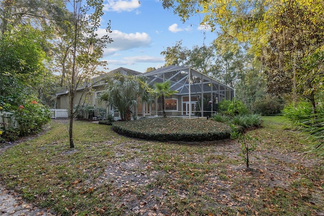 back of property with glass enclosure