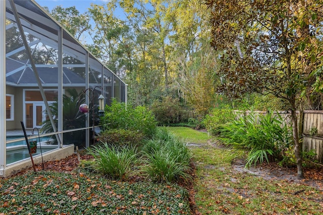 view of yard featuring a lanai