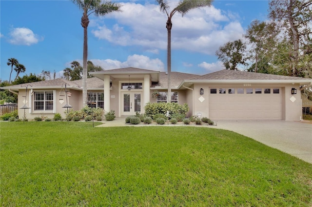 view of front of home with a garage and a front yard