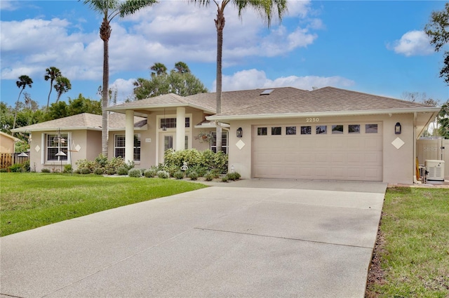 view of front of house with a garage and a front yard