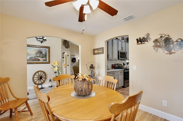 dining space featuring ceiling fan and light hardwood / wood-style floors