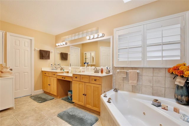 bathroom with tiled bath, tile patterned flooring, and vanity