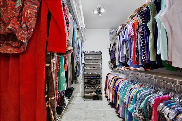 walk in closet featuring light tile patterned floors