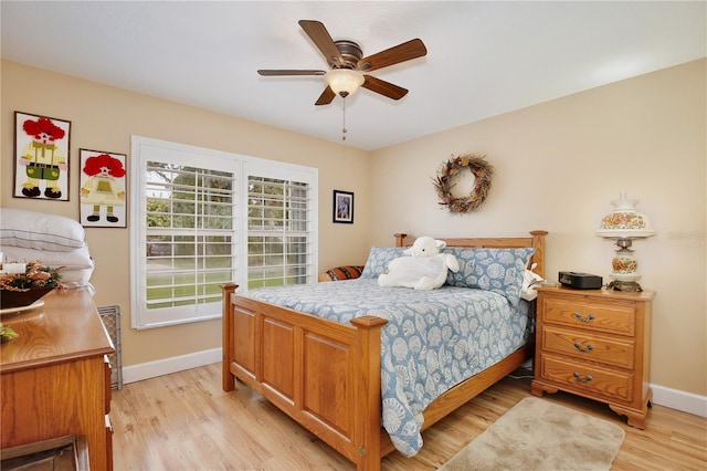 bedroom featuring light hardwood / wood-style floors and ceiling fan