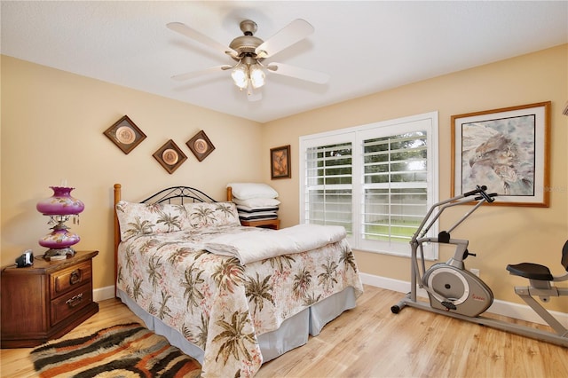 bedroom featuring light hardwood / wood-style flooring and ceiling fan